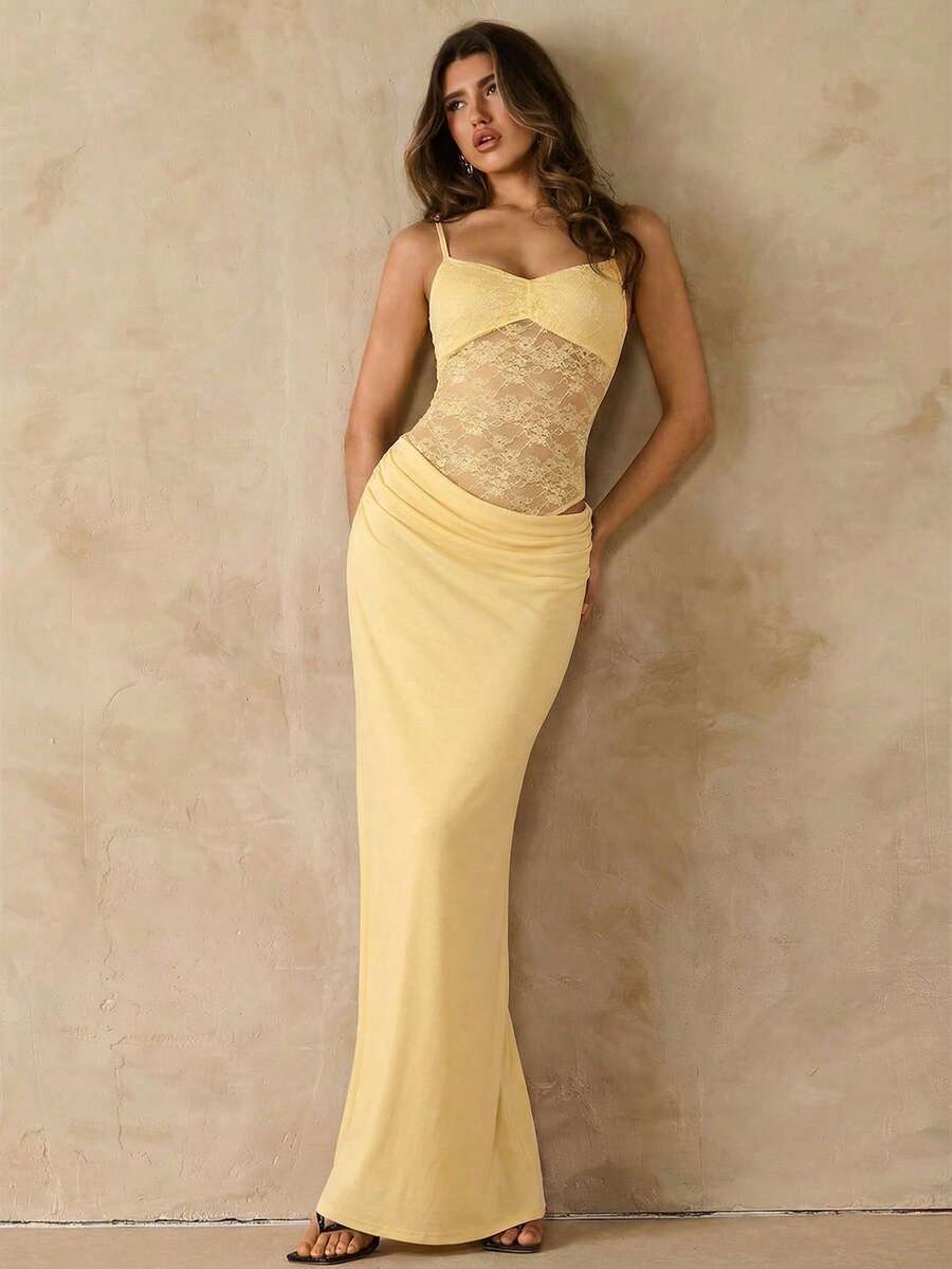 Women's black backless lace patchwork maxi dress with spaghetti straps and mermaid hem.