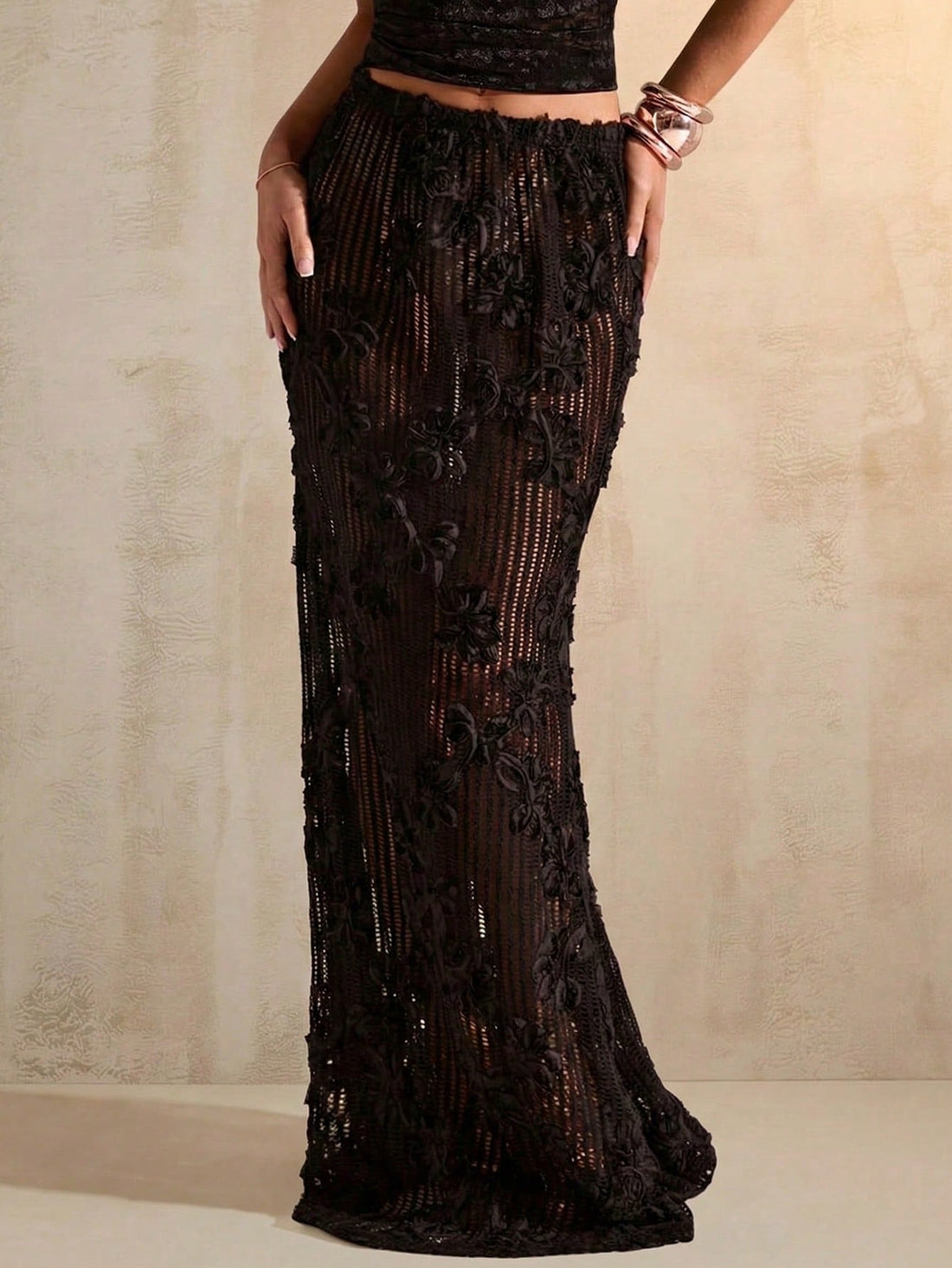 Women's high waist black long mermaid skirt crafted from lightweight knitted fabric for evening parties and night out events.