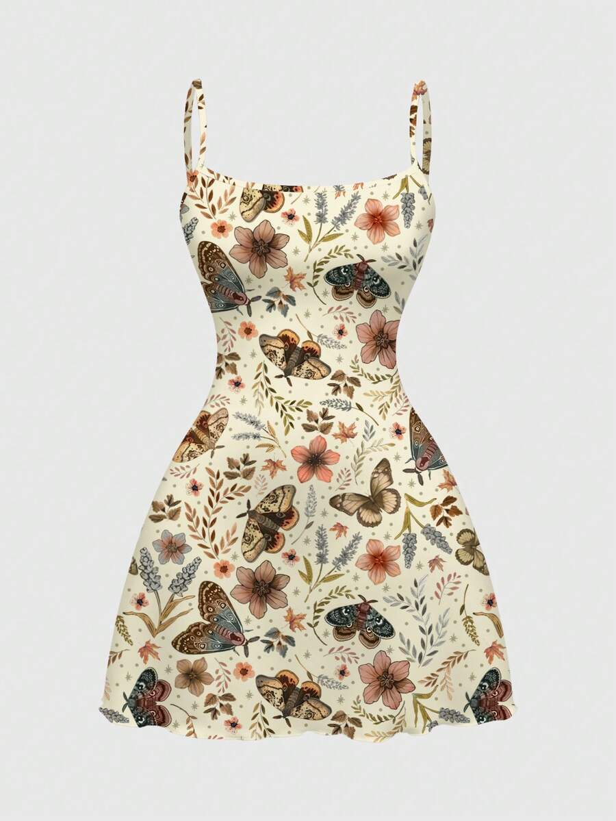 Beige graphic cami mini dress for women featuring a backless slim fit design, high waist flared hem, lettuce trim, spaghetti straps, and arm sleeves.