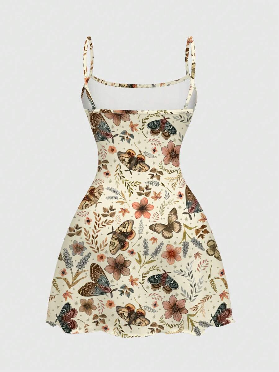 Beige graphic cami mini dress for women featuring a backless slim fit design, high waist flared hem, lettuce trim, spaghetti straps, and arm sleeves.