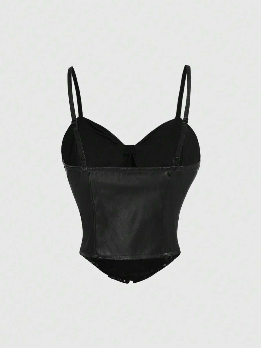 Black goth cami top for women featuring spaghetti straps, lace-up front detail, grommet eyelet accents, and an asymmetrical hem.