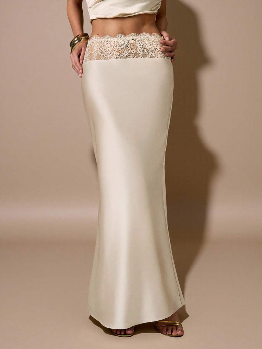 Apricot satin mermaid maxi skirt for women featuring contrast lace patchwork, ruched detailing, and a zipper closure.