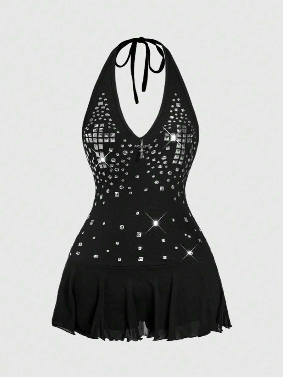 Women's black Y2K backless mesh mini dress featuring an asymmetrical neckline, tie-back knot detail, and a slim fit flared A-line silhouette.