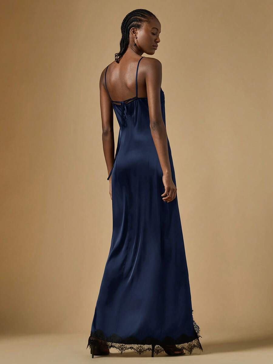 Women's black lace split satin long dress featuring spaghetti straps, asymmetrical slit hem, and matching arm sleeves.