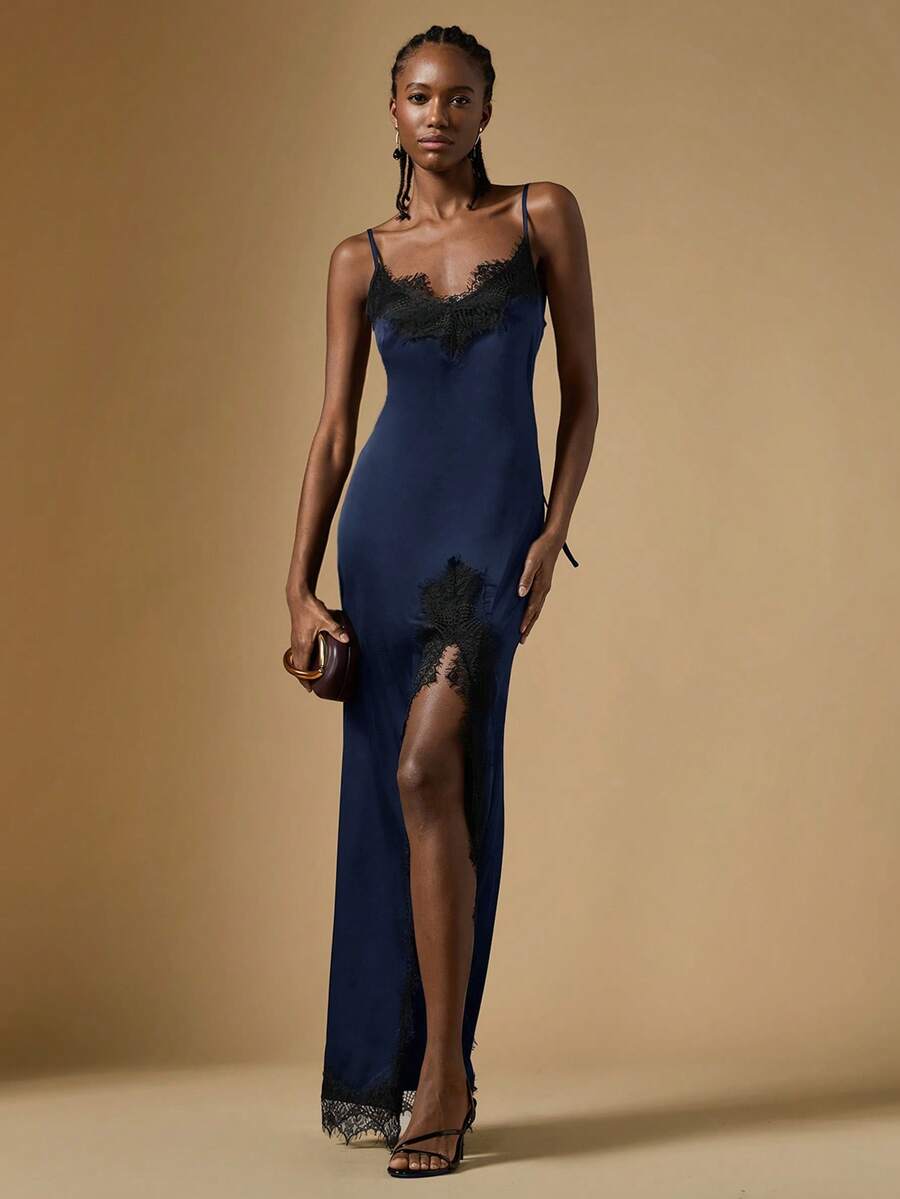 Women's black lace split satin long dress featuring spaghetti straps, asymmetrical slit hem, and matching arm sleeves.