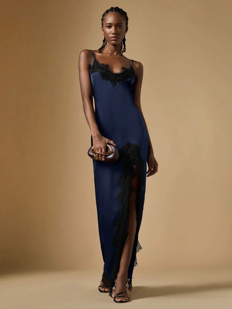Women's black lace split satin long dress featuring spaghetti straps, asymmetrical slit hem, and matching arm sleeves.
