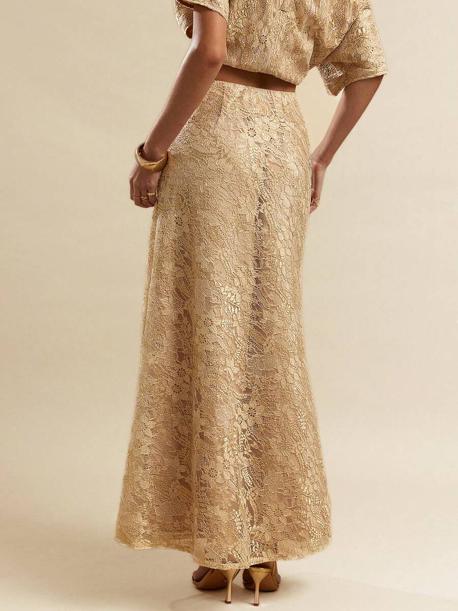 Black low waist extra long mermaid maxi skirt with asymmetrical zipper detail and side slit.