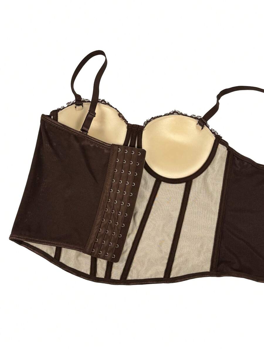 Black women's shaping cami with contrast lace, spaghetti straps, asymmetrical hem, lined body, and slim fit for casual and night-out styling.