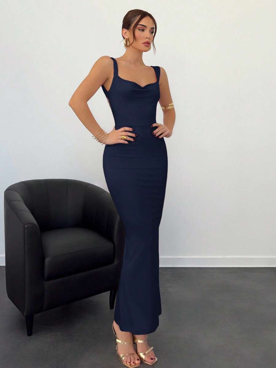 Beige sleeveless backless cami maxi dress for women featuring bow decor, split hem, and slim fit knitted fabric.