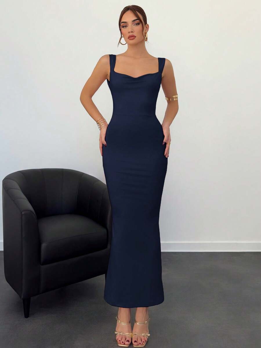 Beige sleeveless backless cami maxi dress for women featuring bow decor, split hem, and slim fit knitted fabric.
