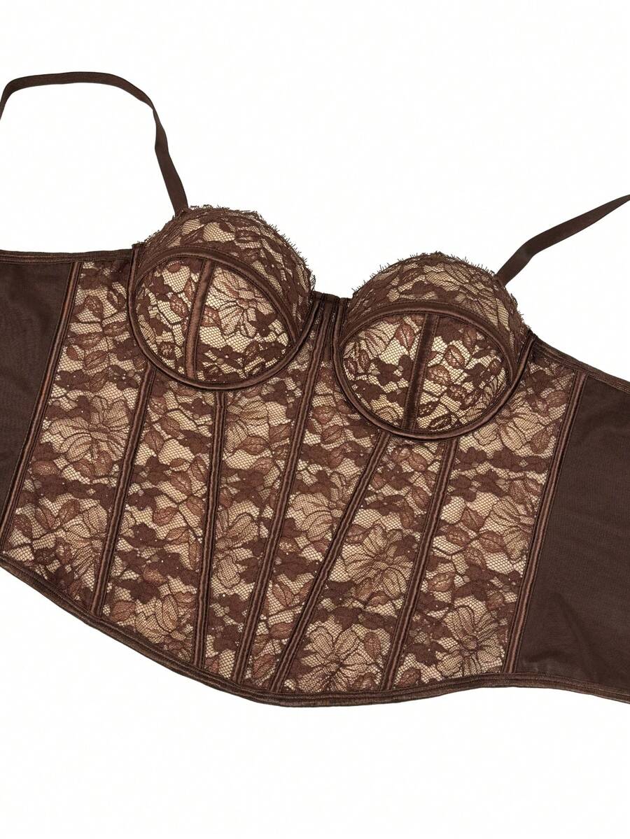 Black women's shaping cami with contrast lace, spaghetti straps, asymmetrical hem, lined body, and slim fit for casual and night-out styling.