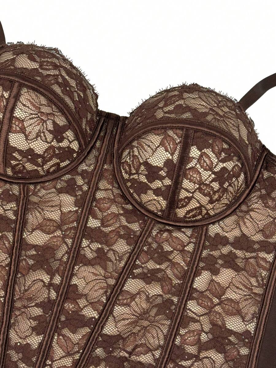 Black women's shaping cami with contrast lace, spaghetti straps, asymmetrical hem, lined body, and slim fit for casual and night-out styling.