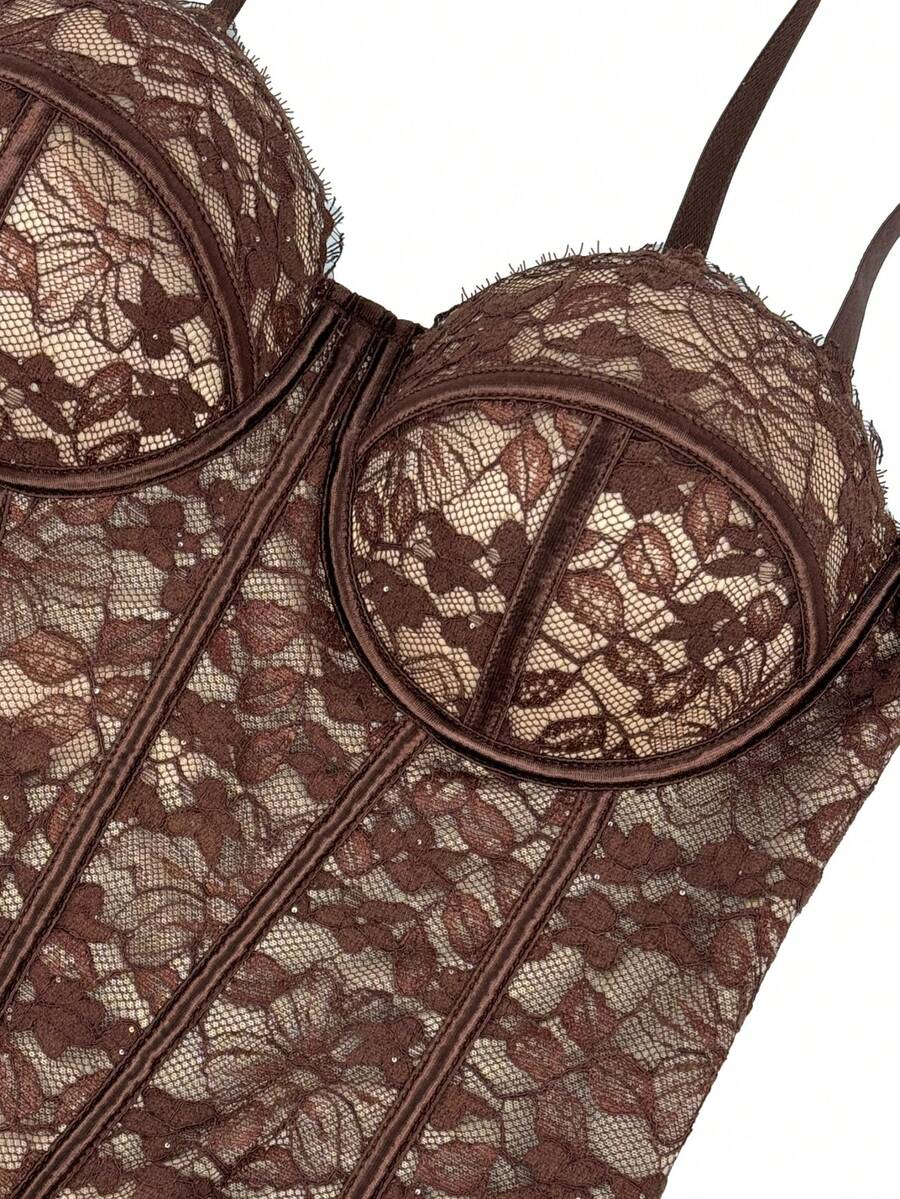 Black women's shaping cami with contrast lace, spaghetti straps, asymmetrical hem, lined body, and slim fit for casual and night-out styling.