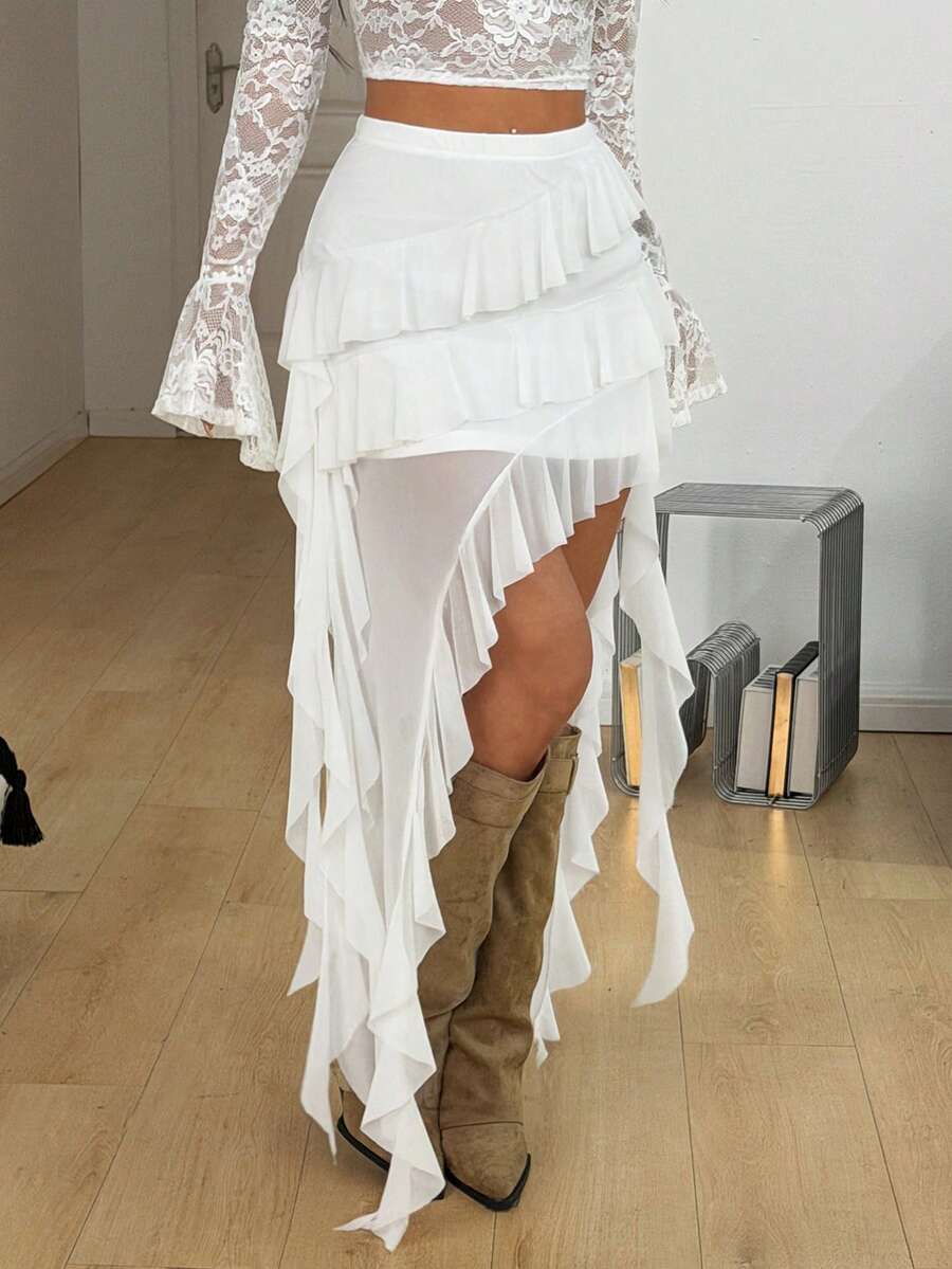 Women's low rise asymmetrical long skirt with tiered ruffle details in stretch knitted fabric.