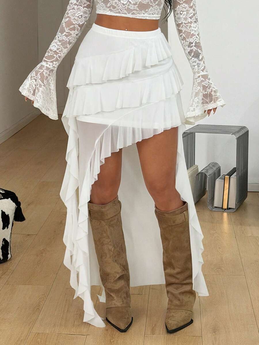 Women's low rise asymmetrical long skirt with tiered ruffle details in stretch knitted fabric.
