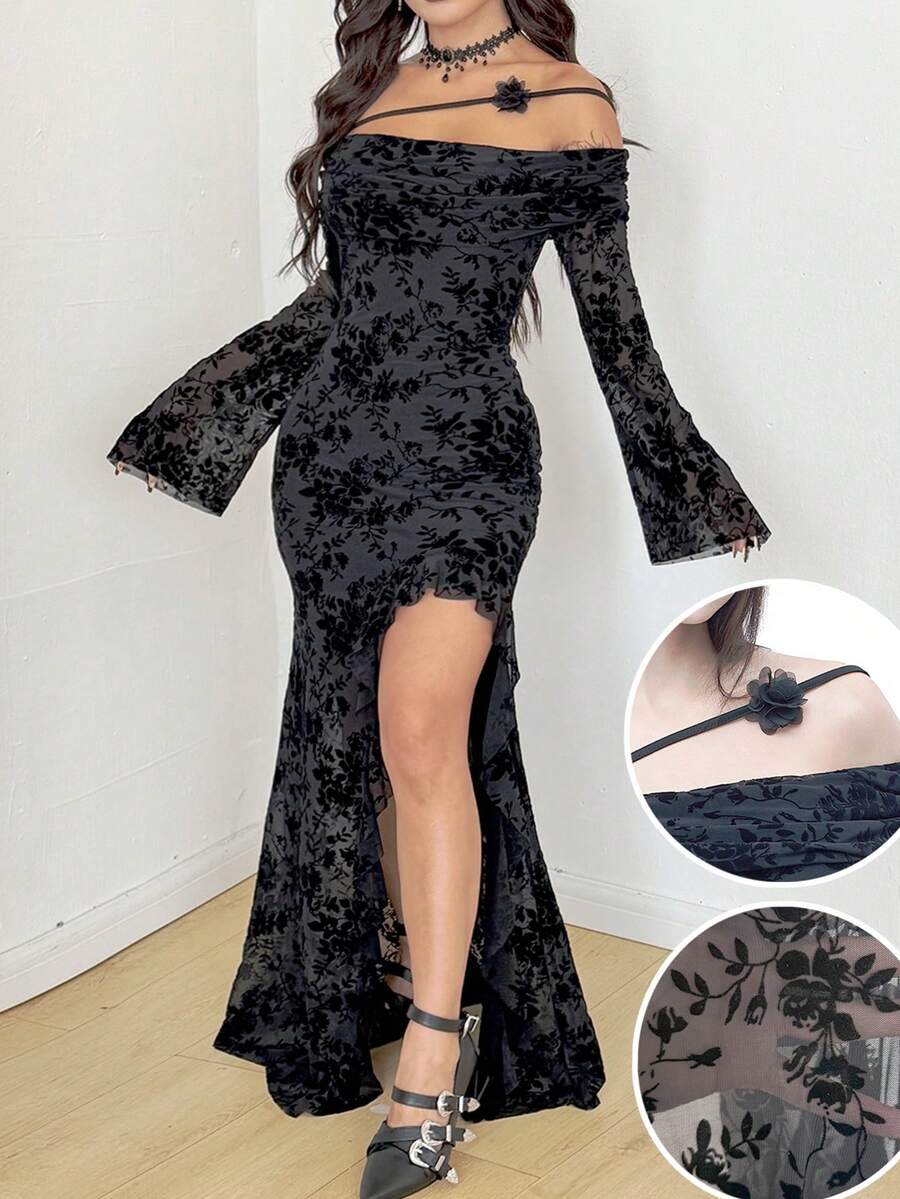 Women's black floral goth maxi dress with an asymmetrical neckline, long sleeves, semi-sheer knitted fabric, and a high split thigh hem in a slim fit bodycon style.