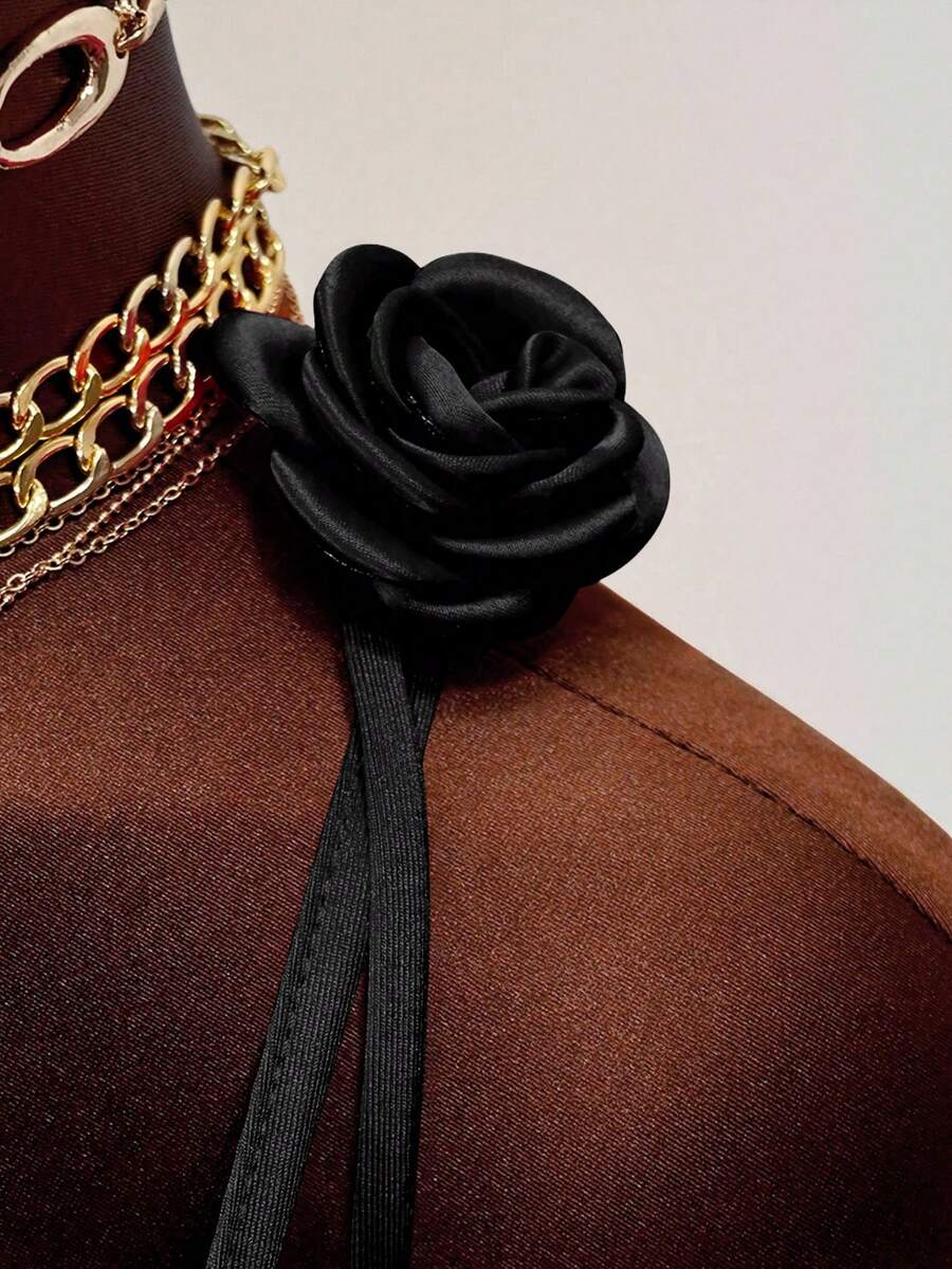 Women's bodycon mini dress featuring a 3D rose accent, thin spaghetti straps, and an open back design.