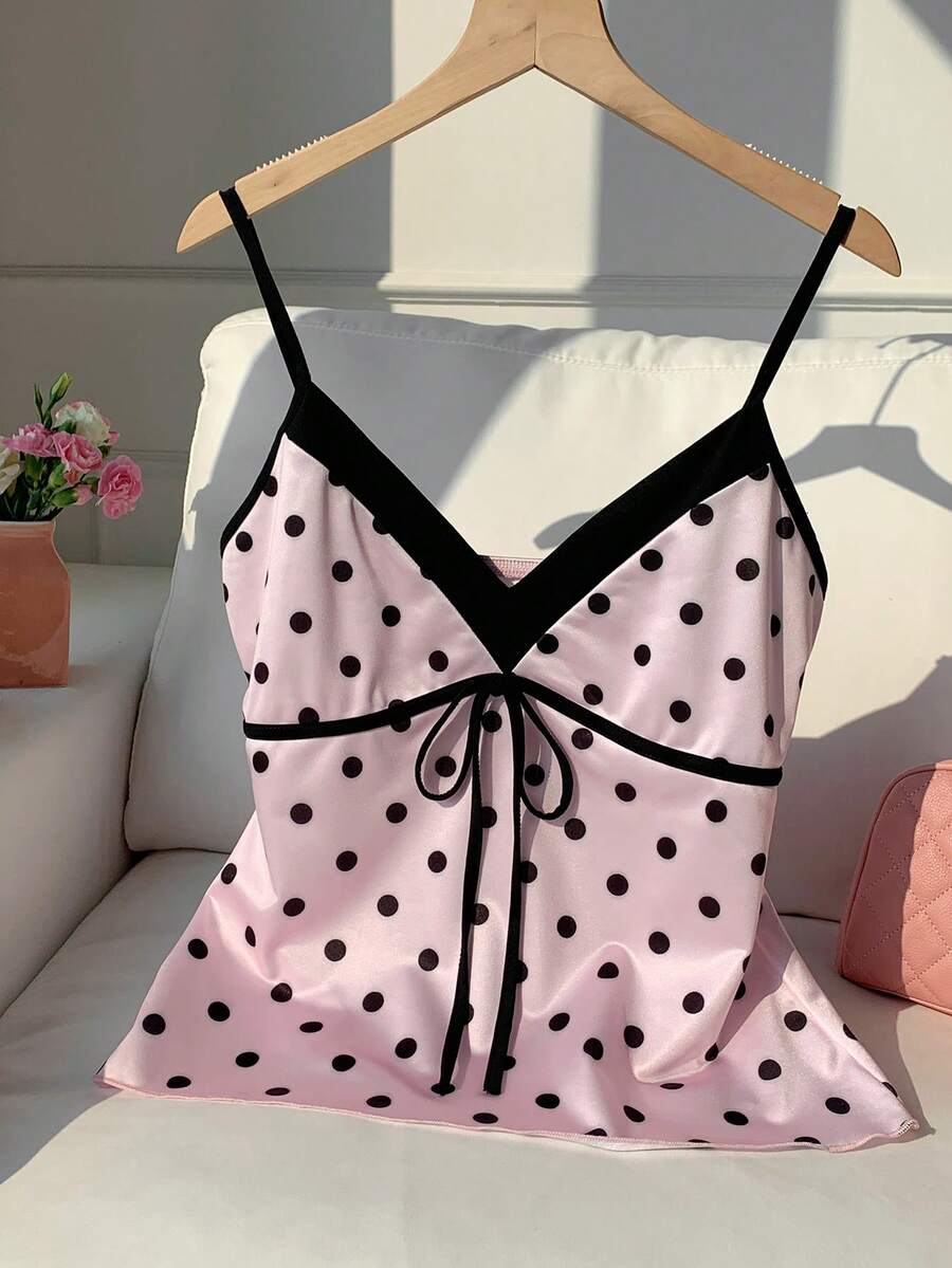 Black and white polka dot tie strap camisole top for women with thin spaghetti straps and slim fit.