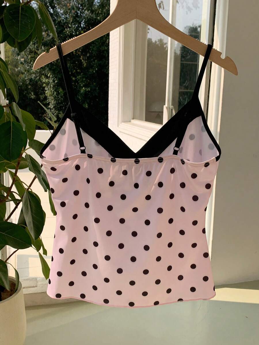 Black and white polka dot tie strap camisole top for women with thin spaghetti straps and slim fit.