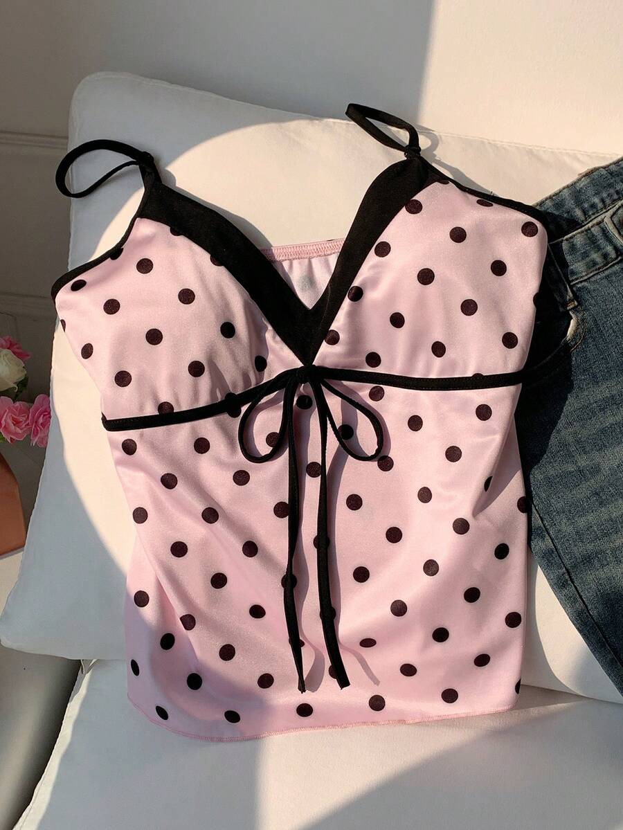 Black and white polka dot tie strap camisole top for women with thin spaghetti straps and slim fit.