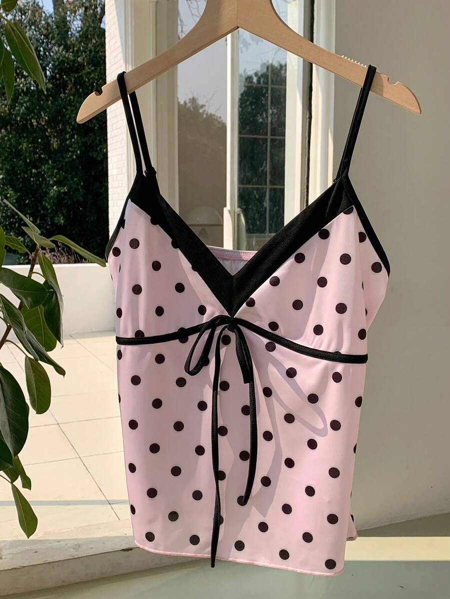 Black and white polka dot tie strap camisole top for women with thin spaghetti straps and slim fit.