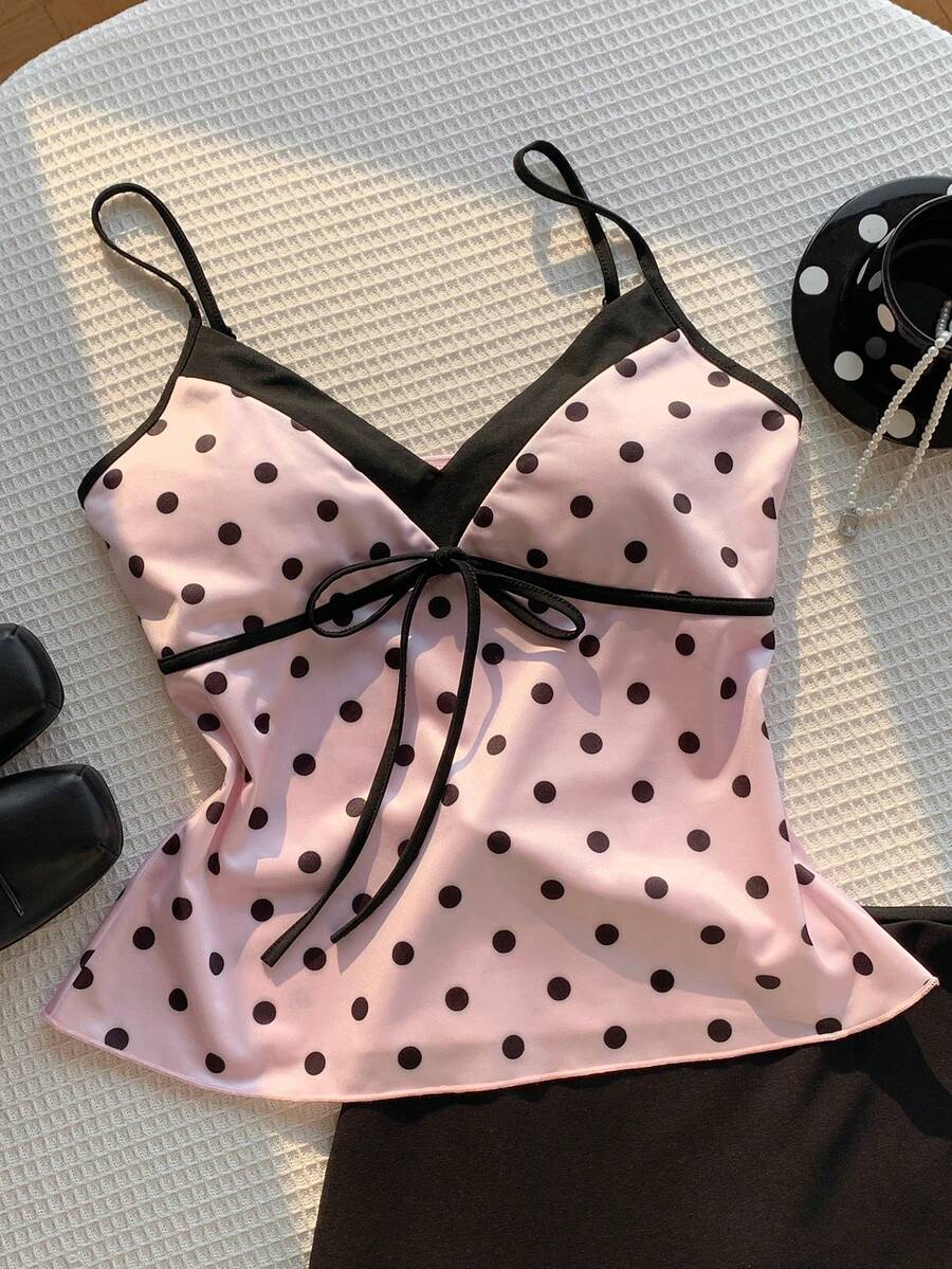 Black and white polka dot tie strap camisole top for women with thin spaghetti straps and slim fit.