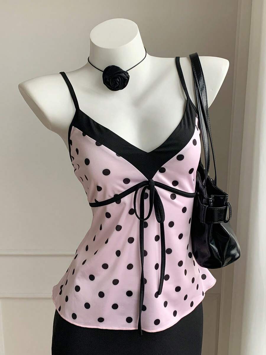 Black and white polka dot tie strap camisole top for women with thin spaghetti straps and slim fit.