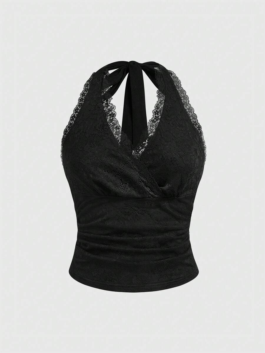 Women's black fitted halter neck camisole featuring contrast lace details, a V-neckline, knot detail, and backless design.