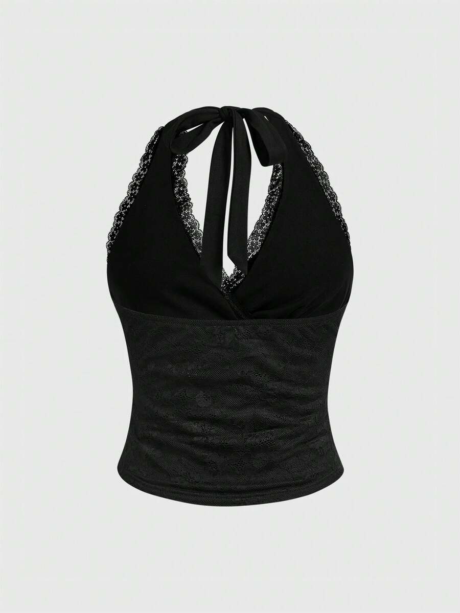 Women's black fitted halter neck camisole featuring contrast lace details, a V-neckline, knot detail, and backless design.