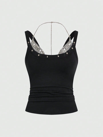 Backless grommet cami tank top featuring slim fit silhouette and strap details on knitted fabric