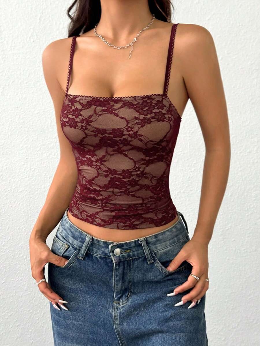 Women's white lace crop camisole top featuring spaghetti straps and slim fit design.