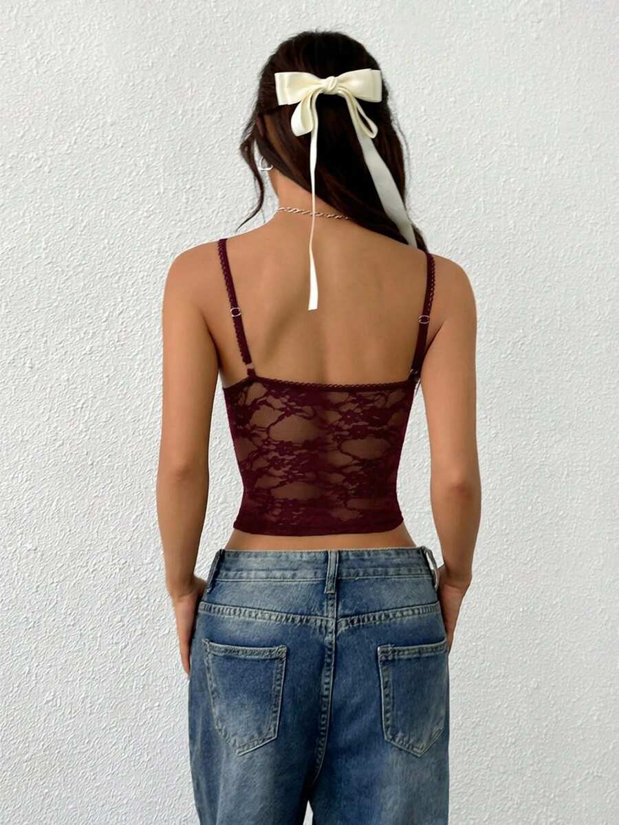 Women's white lace crop camisole top featuring spaghetti straps and slim fit design.