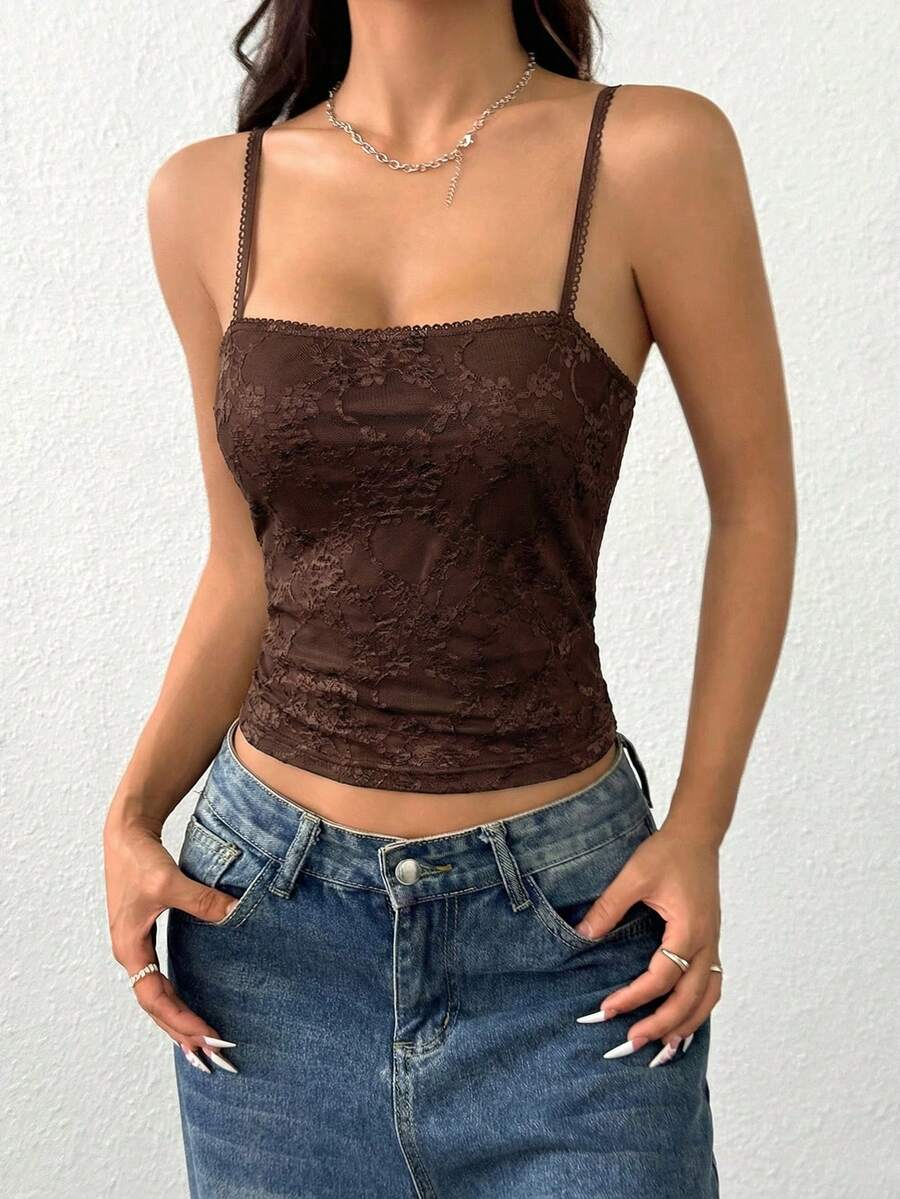 Women's white lace crop camisole top featuring spaghetti straps and slim fit design.