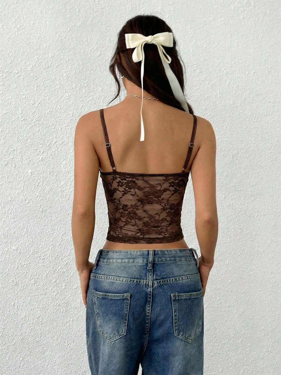 Women's white lace crop camisole top featuring spaghetti straps and slim fit design.