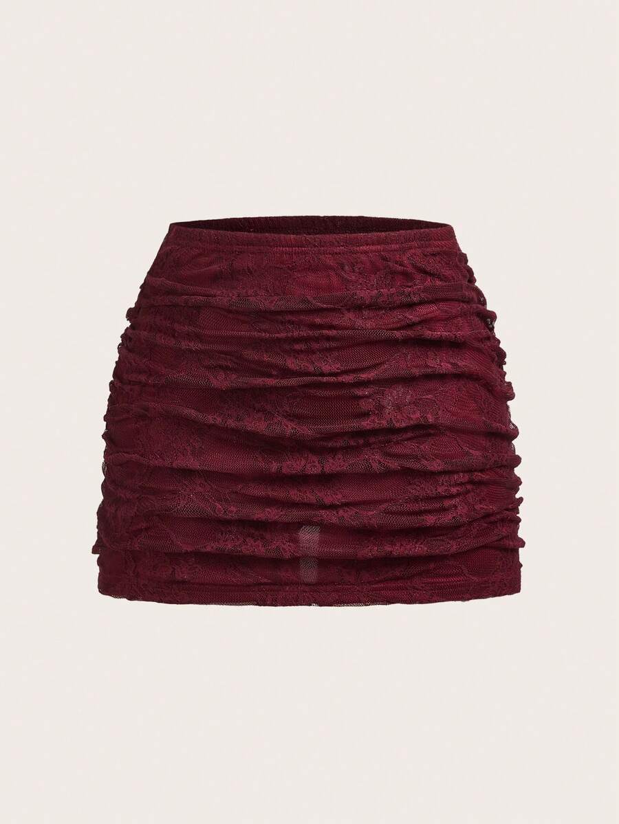 Women's black floral lace mini skirt featuring a ruched bodycon design, mid waist, and high stretch lined fabric.
