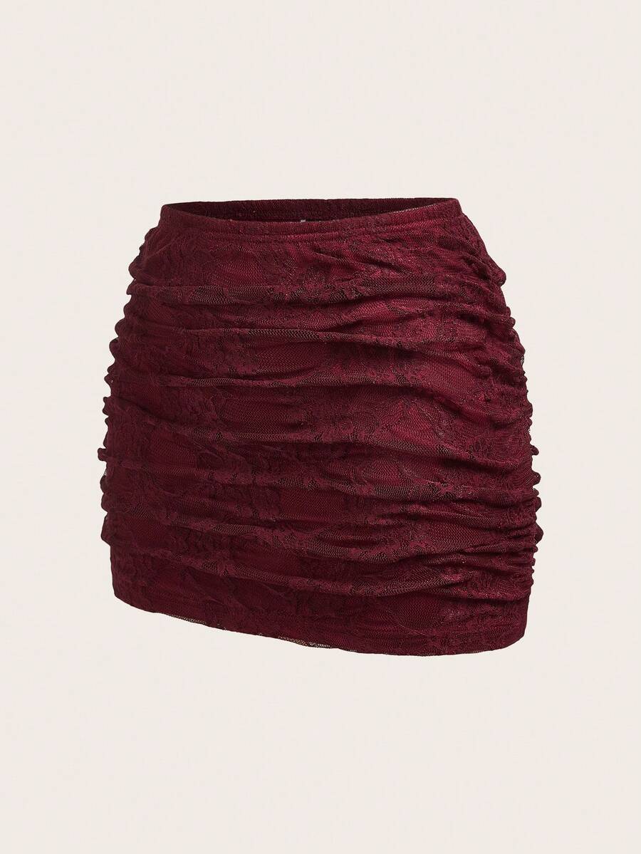 Women's black floral lace mini skirt featuring a ruched bodycon design, mid waist, and high stretch lined fabric.