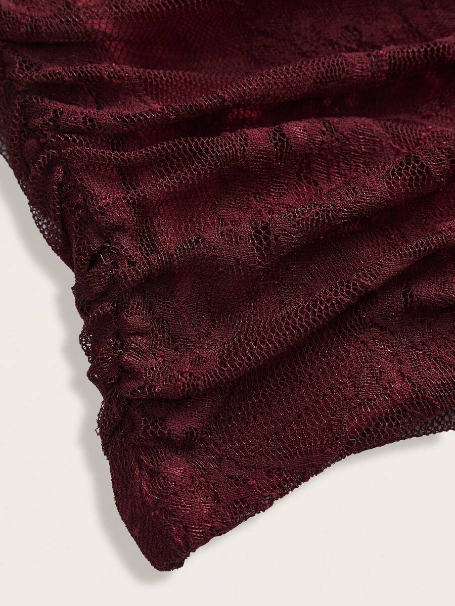 Women's black floral lace mini skirt featuring a ruched bodycon design, mid waist, and high stretch lined fabric.