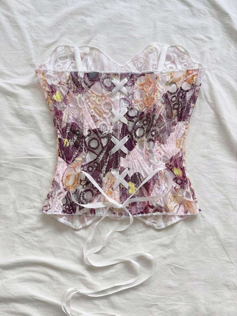 Strapless floral corset top with lace-up detail, asymmetrical hem, and slim fit for women in a boho vacation style.