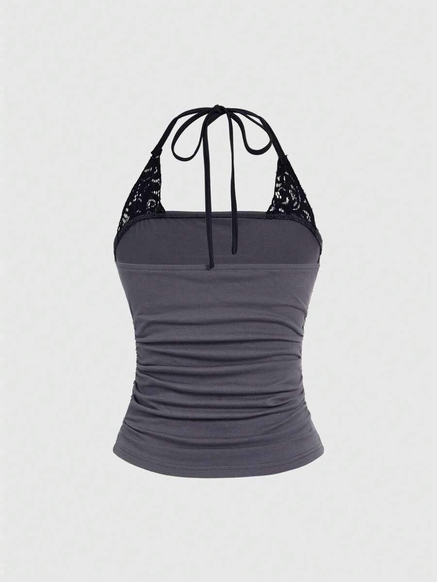 Women's distressed skull print halter crop top featuring 2-in-1 lace splicing design and a backless knot tie.
