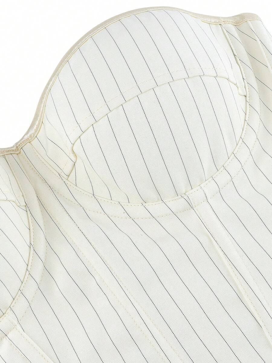 Black overbust corset top with strapless design, boned support, tie-back and zipper closure for women shapewear styling.
