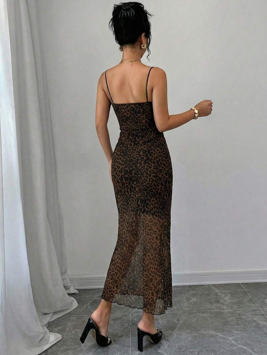 Women wearing a brown leopard print midi cami dress with spaghetti straps, backless detail, and a side split thigh.