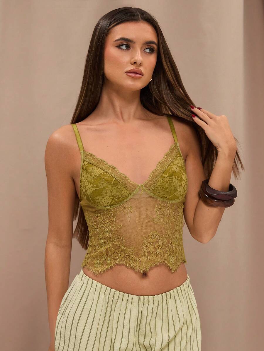 Black floral lace cropped camisole top for women featuring delicate spaghetti straps, cup detail, and semi-sheer contrast lace.