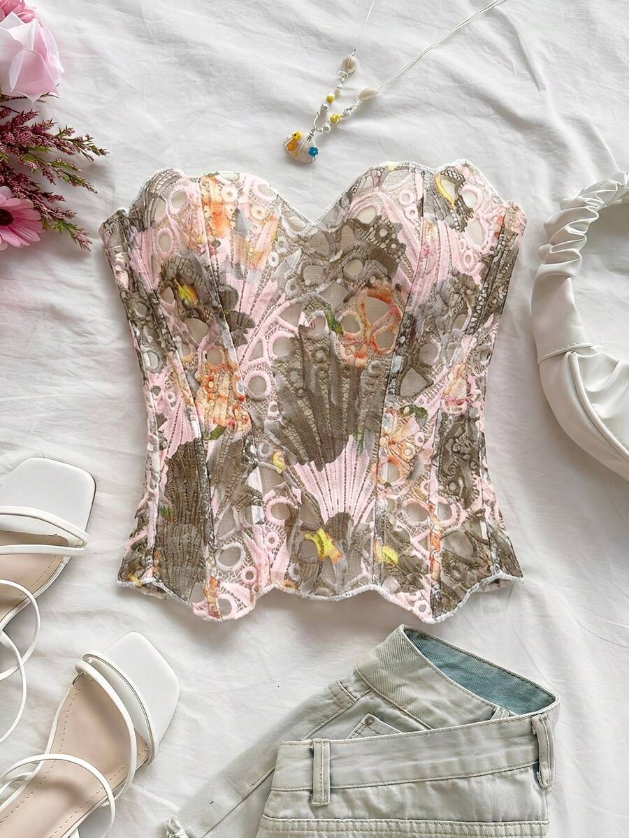 Strapless floral corset top with lace-up detail, asymmetrical hem, and slim fit for women in a boho vacation style.
