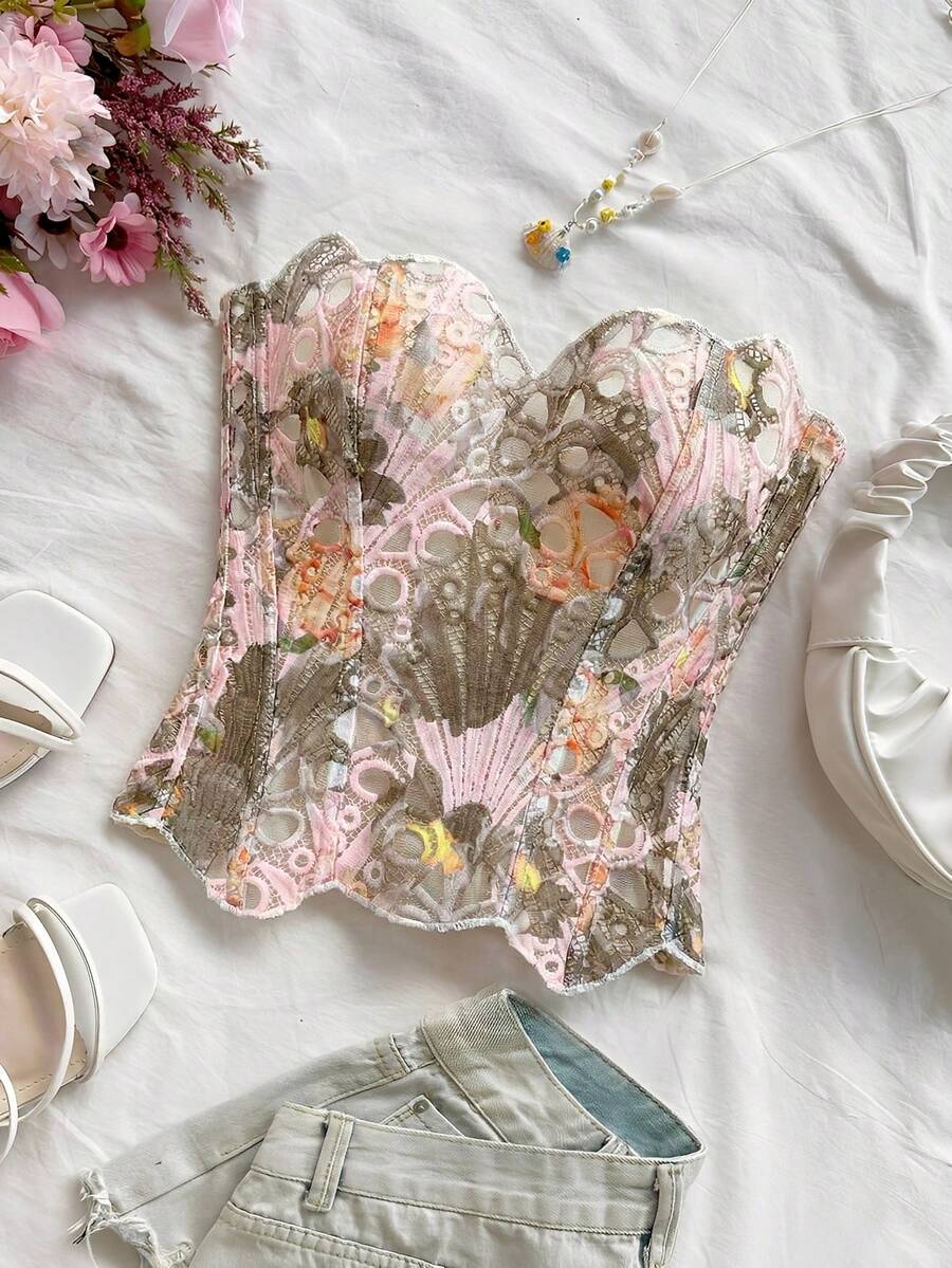 Strapless floral corset top with lace-up detail, asymmetrical hem, and slim fit for women in a boho vacation style.