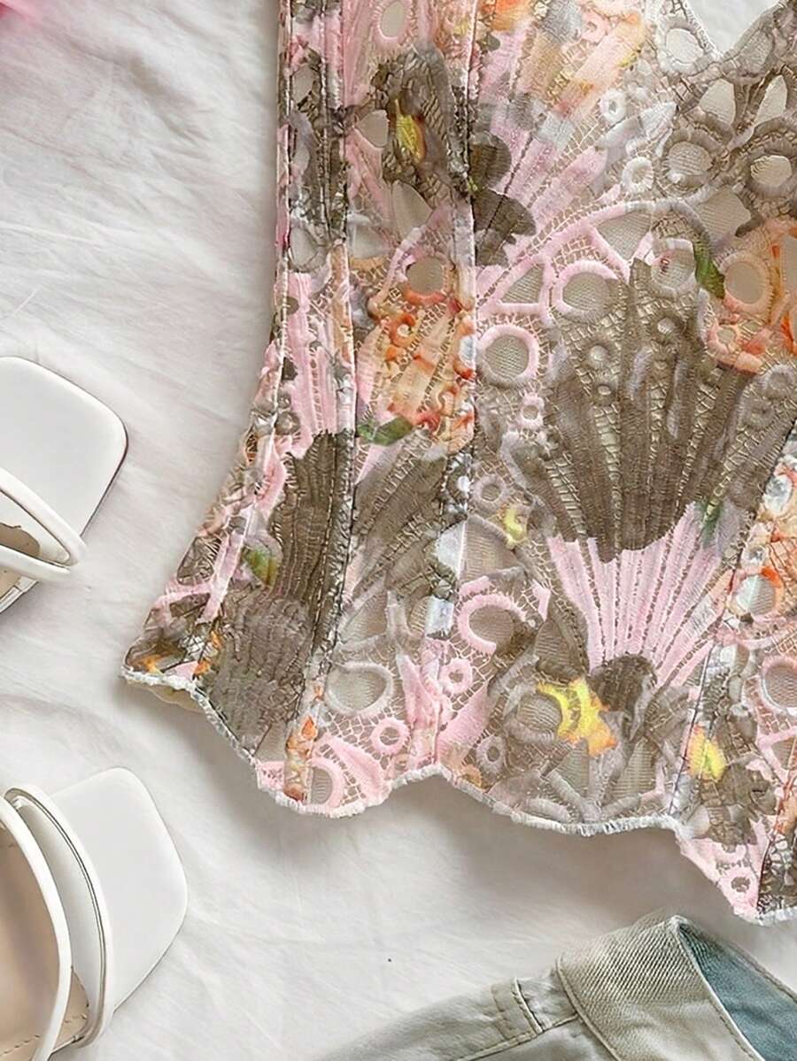 Strapless floral corset top with lace-up detail, asymmetrical hem, and slim fit for women in a boho vacation style.