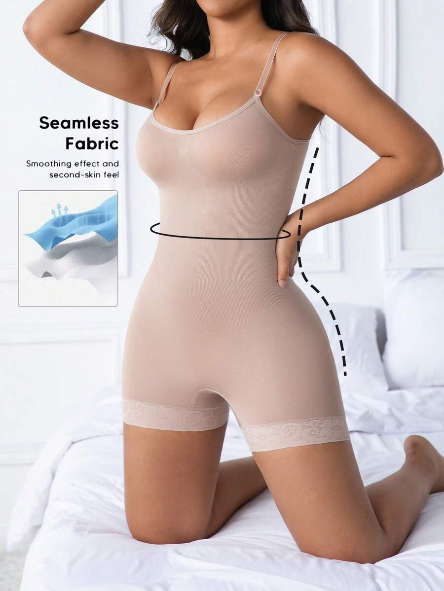 Women's black seamless lace shapewear jumpsuit with spaghetti straps featuring tummy control and full-length coverage.