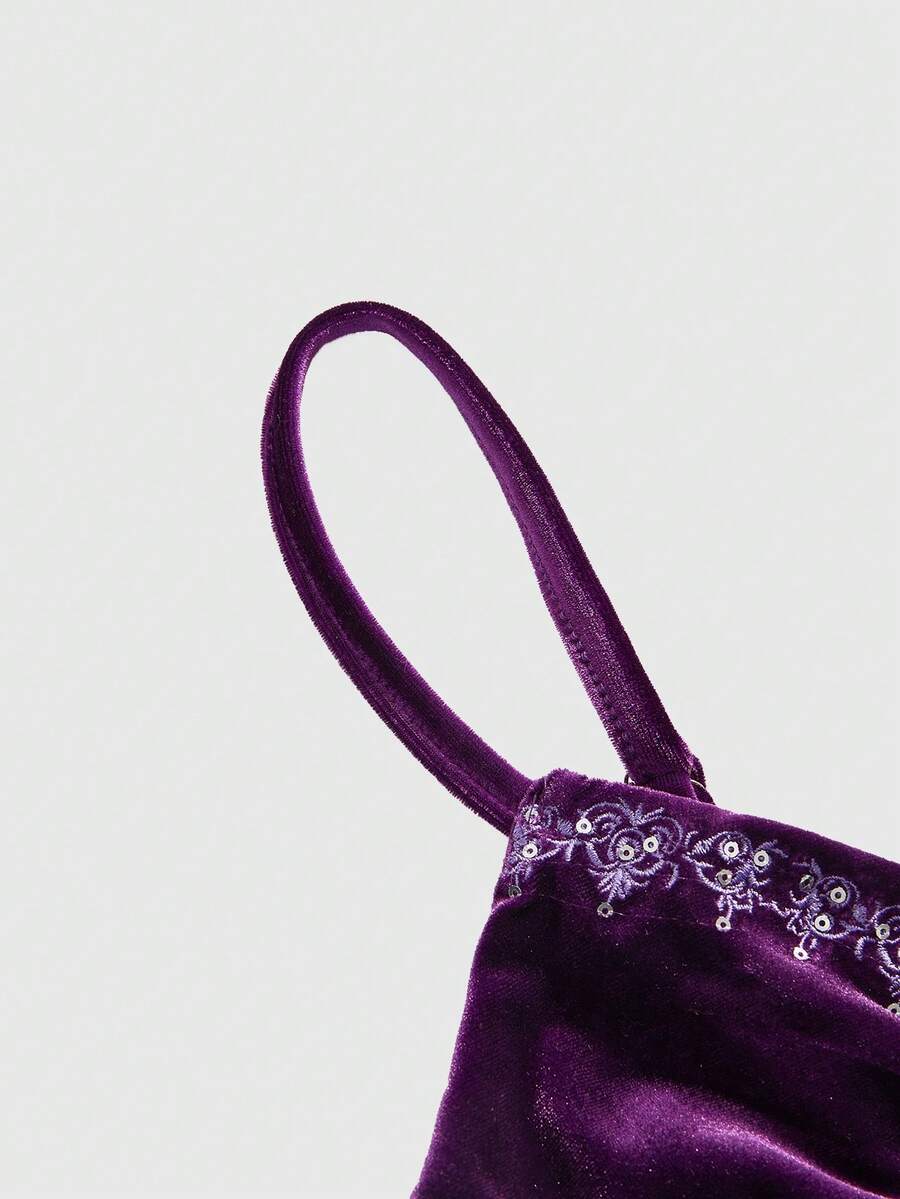 Women's purple velvet camisole top with contrast lace trim and spaghetti straps in a slim fit design.