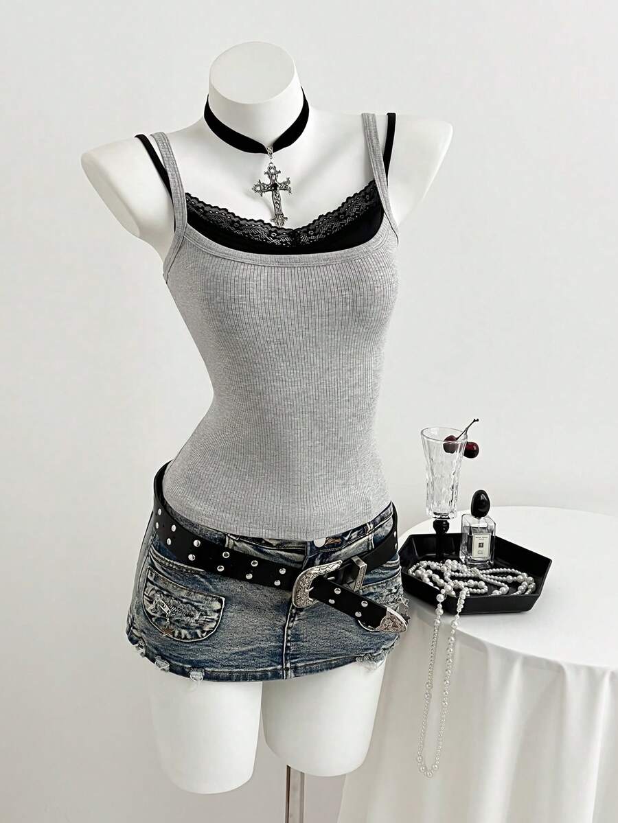 Women's slim fit spaghetti strap cami tank top with contrast lace trim along the neckline