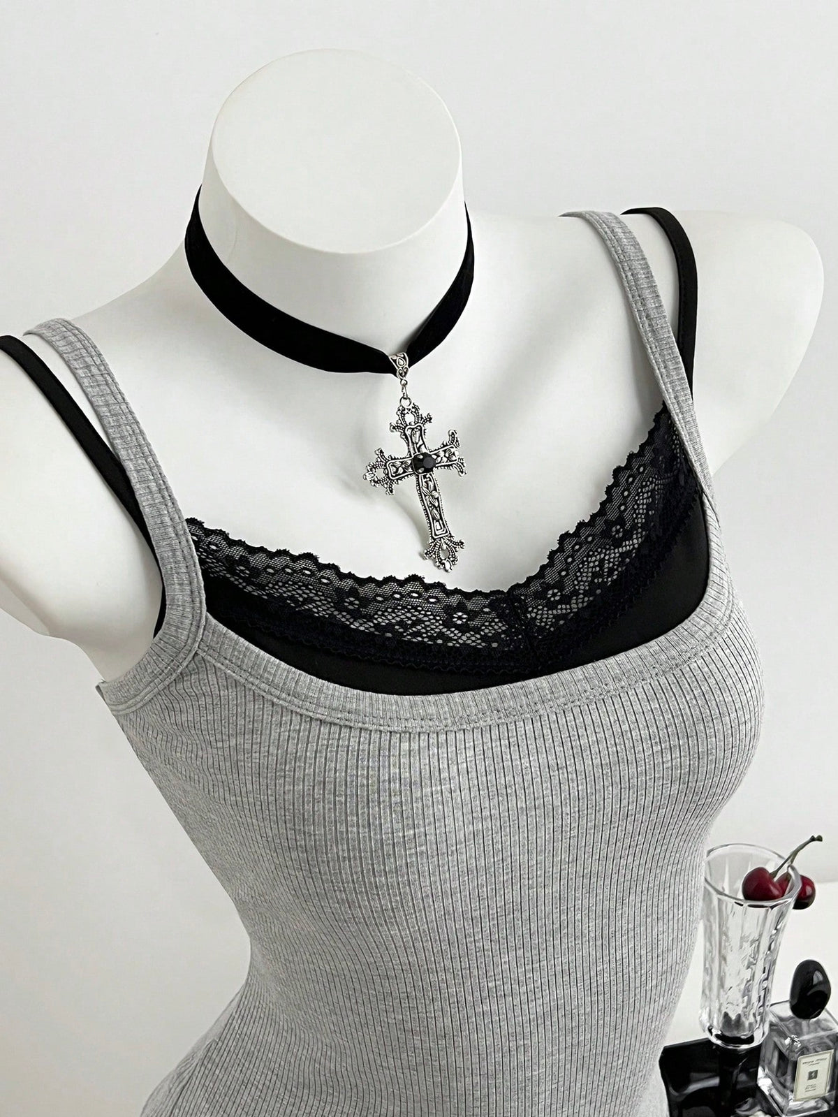 Women's slim fit spaghetti strap cami tank top with contrast lace trim along the neckline