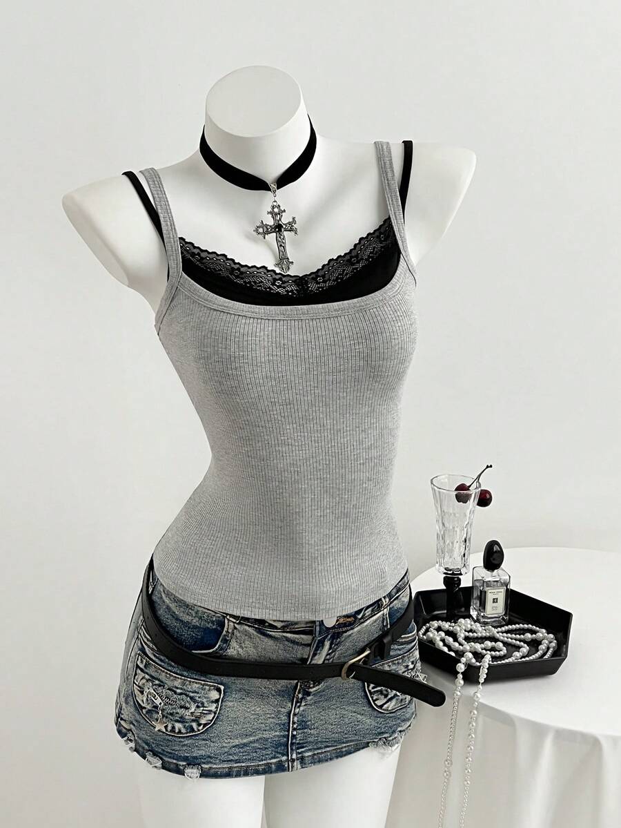 Women's slim fit spaghetti strap cami tank top with contrast lace trim along the neckline